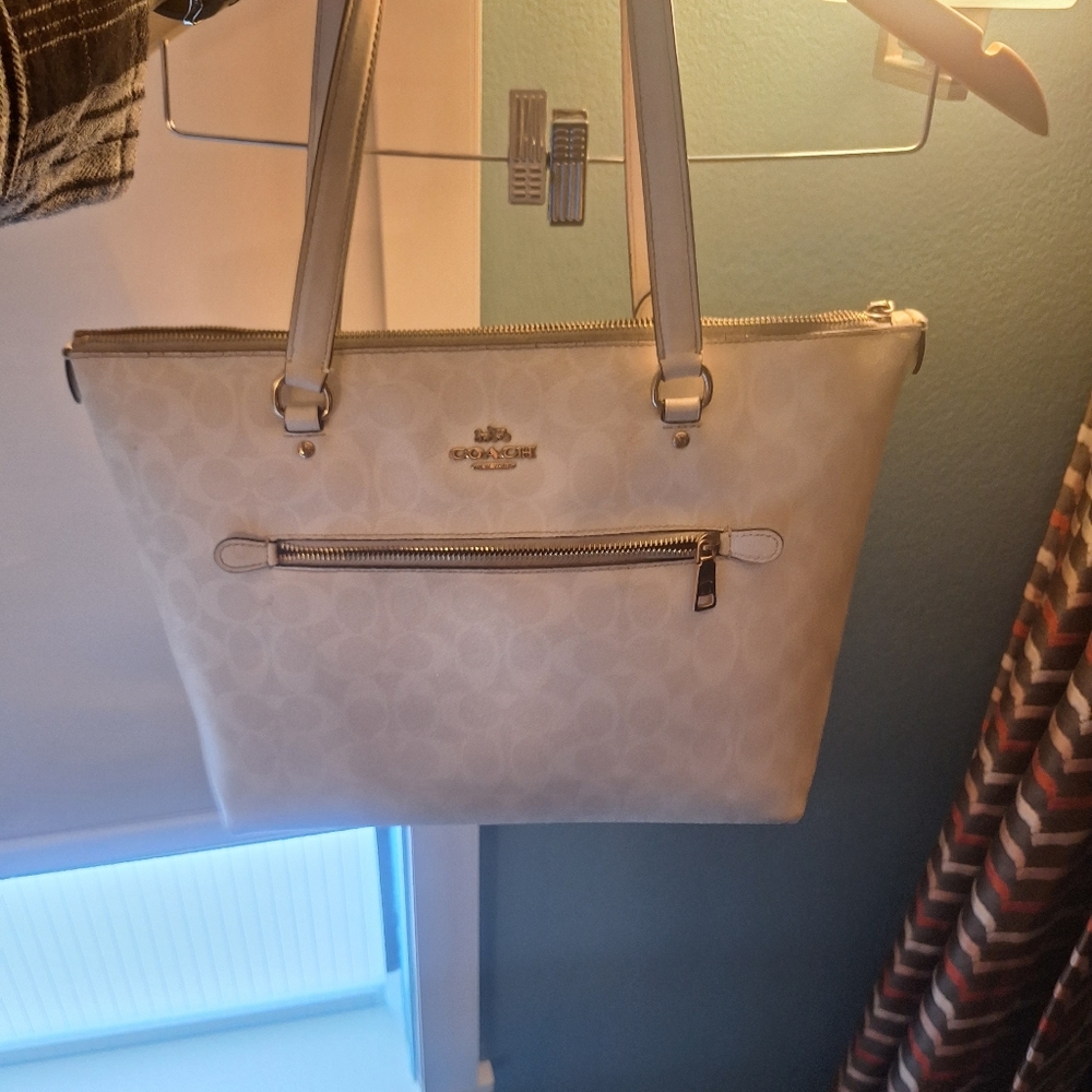 Coach beige and white purse.